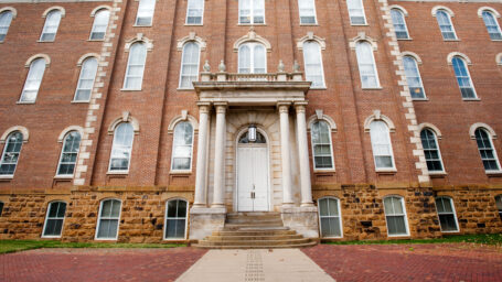 Exterior of The Old Man building with reddish brown bricks